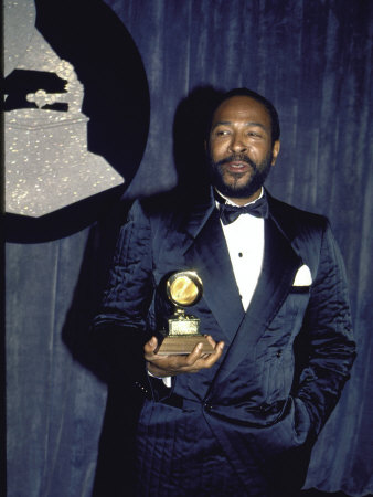 Singer Marvin Gaye Holding His Award in Press Room at Grammy Awards