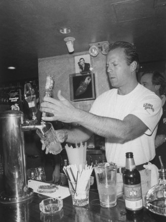 Actor Bruce Willis Working as a Bartender at His Restaurant Planet Hollywood