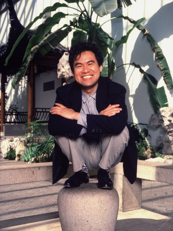 Asian-American Playwright David Henry Hwang Posed Crouching on a Law Stone Pedestal