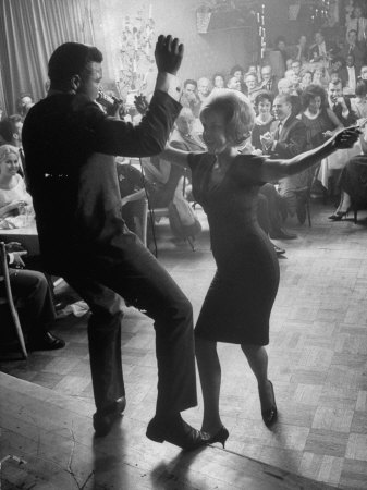 Pop Singer Chubby Checker Singing His Hit Song "The Twist" on Dance Floor at Crescendo Nightclub