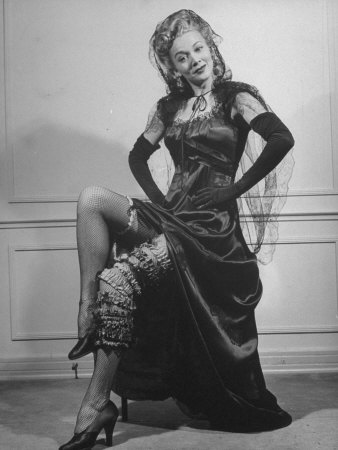 Actress Carole Landis Wearing Many Garters on Leg at Garter Party for Hollywood Correspondents