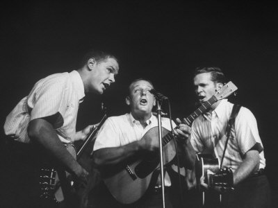 The Kingston Trio Dave Guard, Nick Reynolds, and Bob Shane During a Concert