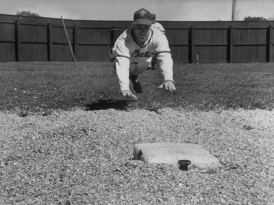 Baseball Player Richie Ashburn Making a Belly-Whopper Slide into Base During Practice