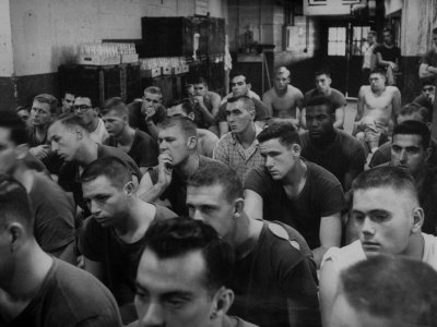 Syracuse Football Player Jim Brown Sitting with His Teammates