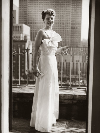 Photographer Margaret Bourke-White, in Evening Dress, Standing on Balcony Holding a Drink