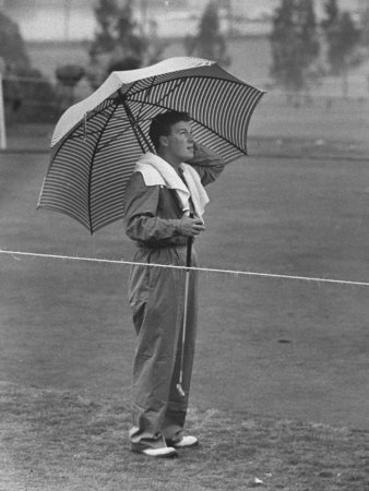Australian Golfer Peter Thompson, Standing under Oversized Umbrella During the Los Angeles Open Poster
