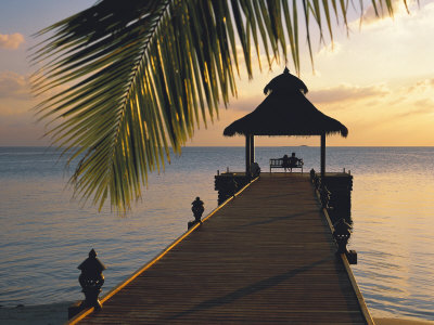 Couple Looking at Sunset on a Jetty, Maldives, Indian Ocean