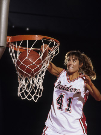 Female Basketball Player Dunking a Ball Through the Hoop Poster