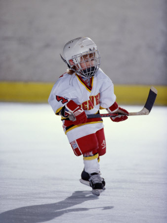 Young Ice Hockey Player in Action Poster