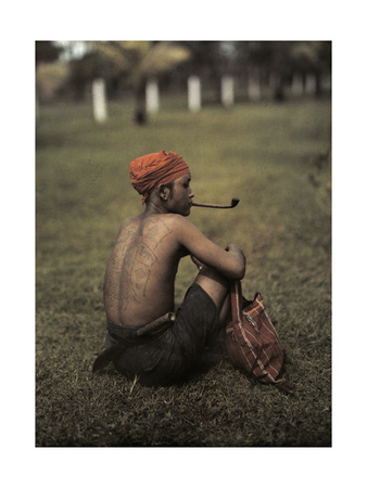 Kahme Man Displays Tattooed Back, the Tattoos Represent Good-Luck