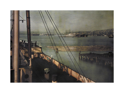 Historical image of ships at dock in Seattle, Washington.