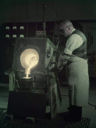 Man Pours New Metal Alloy from Furnace to Mold for Telephone Magnets