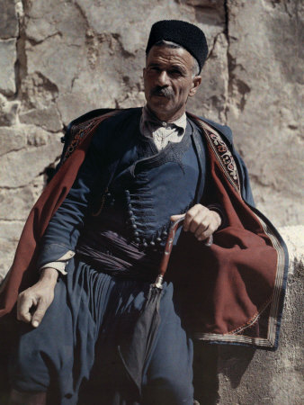 Man Poses in the National Costume of Crete