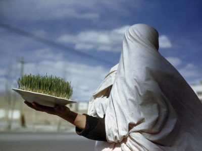 Buy Woman Holds Plate Containing New Grain Sprouts to Celebrate New Year at AllPosters.com