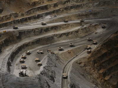 Trucks Hauling Waste Rock at Batu Hijau, a Copper and Gold Mine