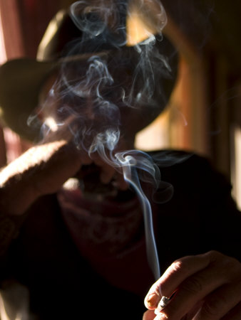 Cowboy Actor Smoking on an Old Western Movie Set