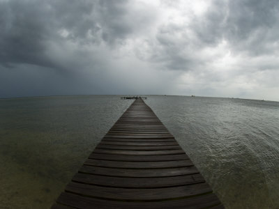 Storm Clouds over Horizon and Dock on the Gulf Coast