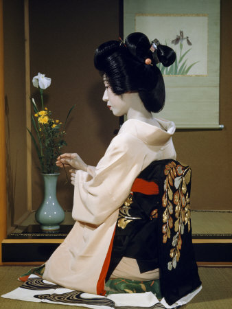 Portrait of a Seated Geisha Wearing Kimono and Obi