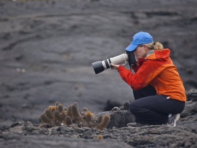 Female Photographer Shooting Cactus with a Large Lens