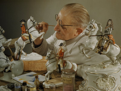 Craftsman Retouches Paint on Porcelain Figurines before Refiring