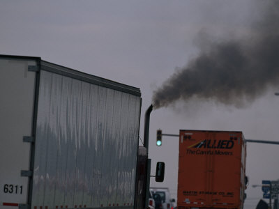 Buy Diesel Truck Belching Exhaust from it's Smokestack at a Truckstop at AllPosters.com