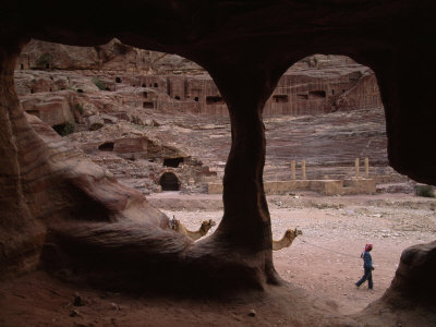 Bedouin Leads His Camel Past the Ruins of the Roman Theater at Petra