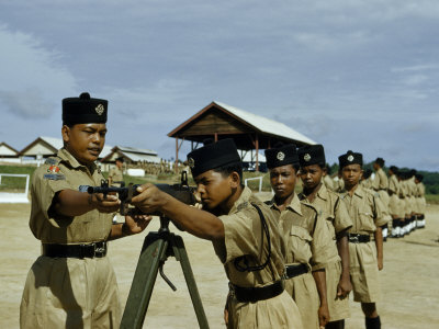 Police Recruits Learn to Sight an Army Rifle