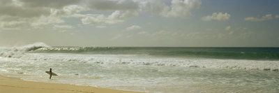 Surfer Standing on the Beach, North Shore, Oahu, Hawaii, USA