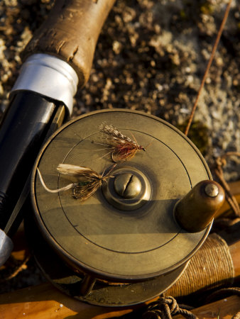 Traditional Brass Fishing Reel Fitted to a Split-Cane Fly Rod with Trout Fishing Flies, UK