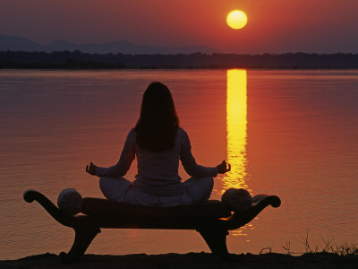 Yoga on a Saddle Bench Watching the Sun Go Down across the Zambesi River, Zambia
