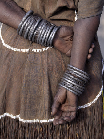 Buy Numerous Decorated Iron Bracelets Worn by a Datoga Woman, Tanzania at AllPosters.com