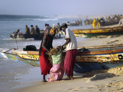 Buy Mauritania, Nouakchott Fishermen Unload Gear from Boats Returning to Shore at Plage Des Pecheurs at AllPosters.com