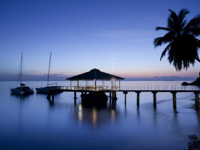 Seychelles, Praslin Island, Anse Bois De Rose, Pier at the Coco De Mer Hotel, Sunset