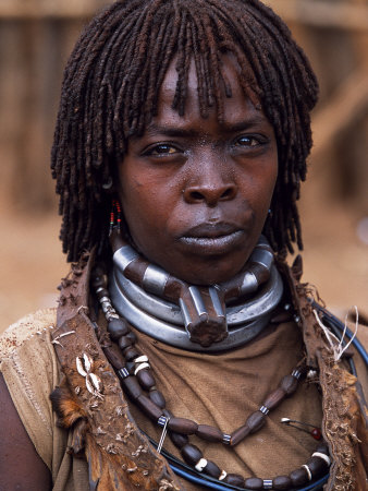 Hamar Woman in Village Square of Dimeka, Married Women Wear Two Heavy Steel Necklaces, Ethiopi