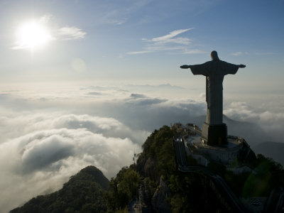 Christ the Redeemer Statue at Sunrise Above the Clouds