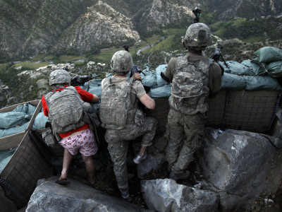 U.S. Soldiers Take Defensive Positions after Attacks from Taliban Positions in the Korengal Valley 