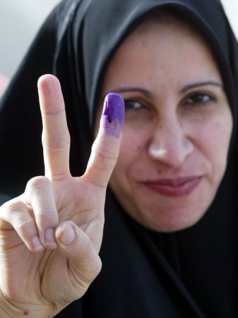 Iraqi Woman Holds Up Her Purple Finger, Indicating She Has Just Voted in Southern Iraq