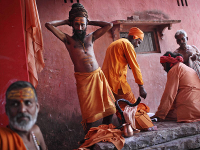 Hindu Holy Men Relax after Taking Holy Dip in River Ganges During the Kumbh Mela Festival in India