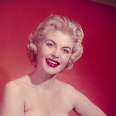 Busty, Fifties Blonde with a Winning Smile