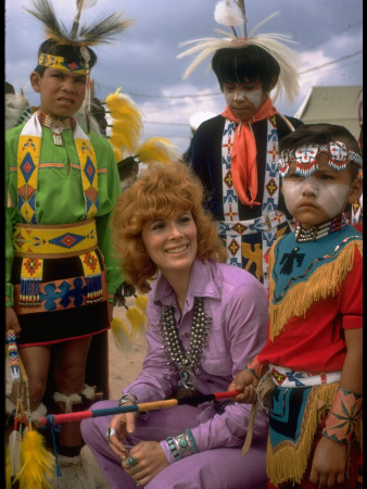Jill St. John Wearing Turquoise Jewelry Surrounded by Colorfully Costumed Navajo Children