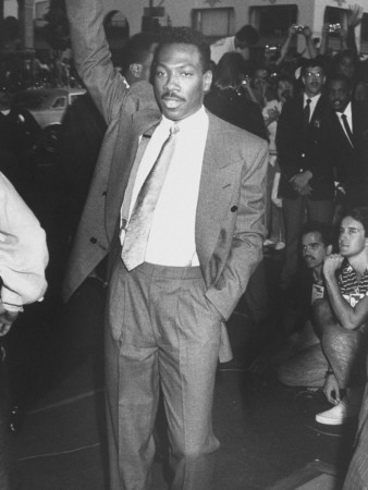 Actor Eddie Murphy Waving His Hand at Fans