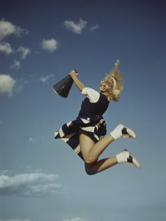 Cheerleader Jumping Holding Megaphone Poster