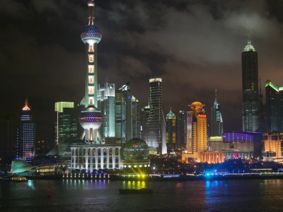 China, Shanghai, Night View of High Rises and Oriental Pearl TV Tower by Huangpu River