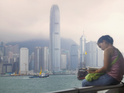 China, Hong Kong, Girl Reading a Book on the Waterfront