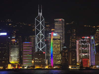 China, Hong Kong, Night View of High Rises by the Waterfront Including Bank of America