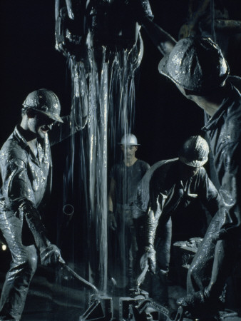 Oilmen Covered in Mud Pull Up a Drill Pipe to Change the Bit