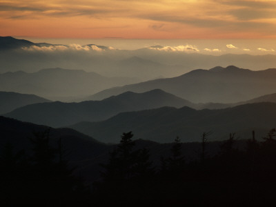 Buy Sunset Casts a Colorful Glow over Mountaintops Shrouded in Fog at AllPosters.com