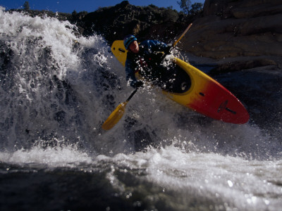 Buy Suspended in Mid-Air, a Kayaker Sails Sideways Down a Short Waterfall at AllPosters.com