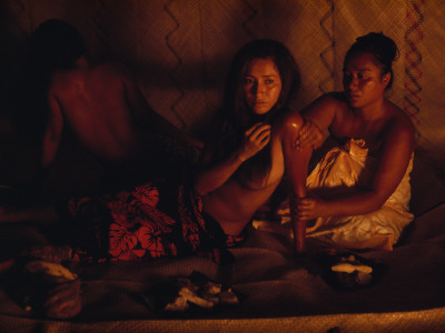 Buy A Topless Tahitian Dancer Is Annointed with Coconut Oil by Firelight at AllPosters.com