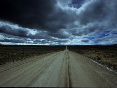 Buy Dark Storm Clouds over Dirt Road and Grasslands of Saskatchewan at AllPosters.com